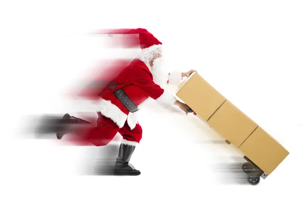 Santa Claus uitgevoerd en het leveren van kerstcadeau — Stockfoto