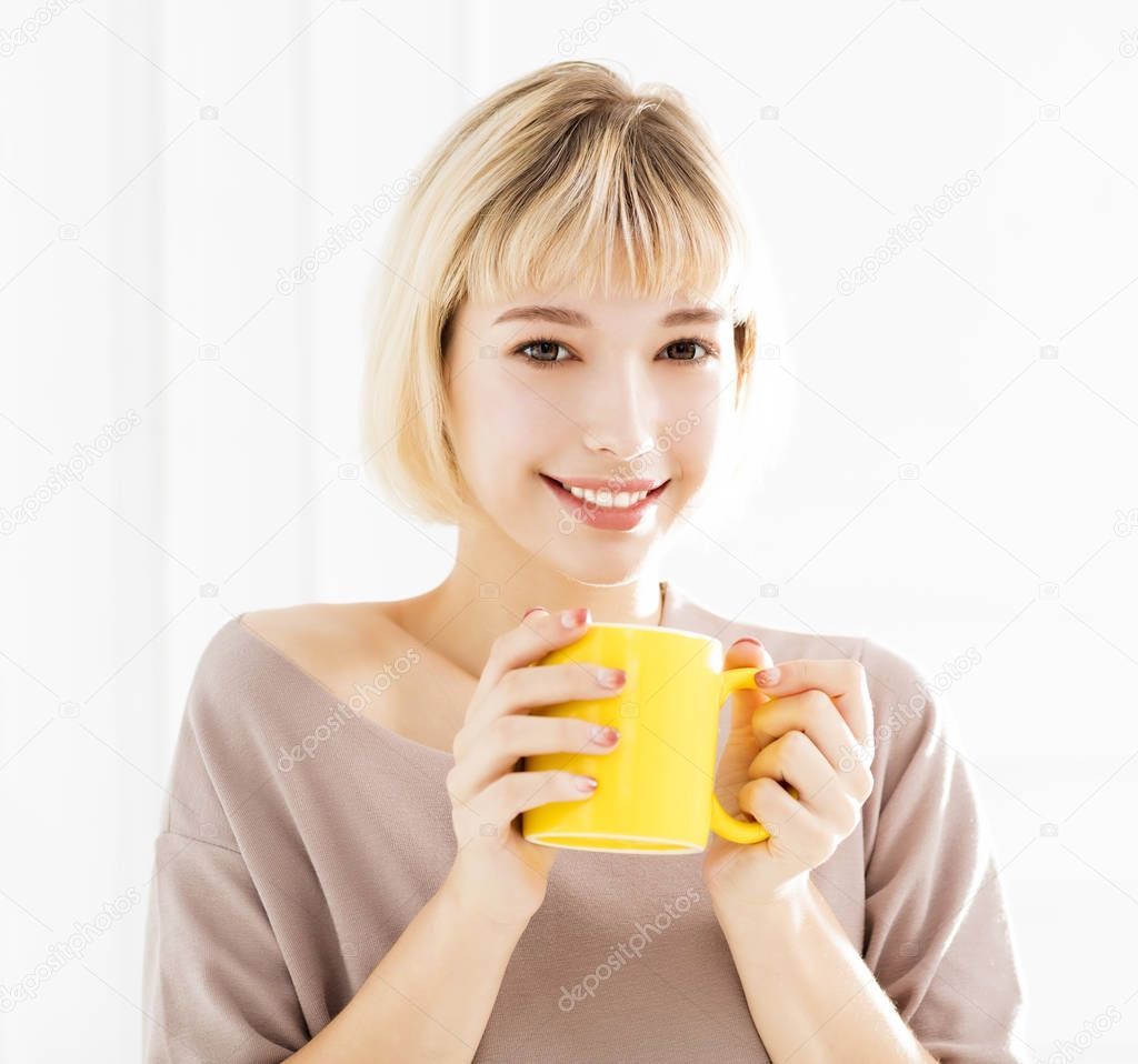 smiling woman Enjoying coffee at home