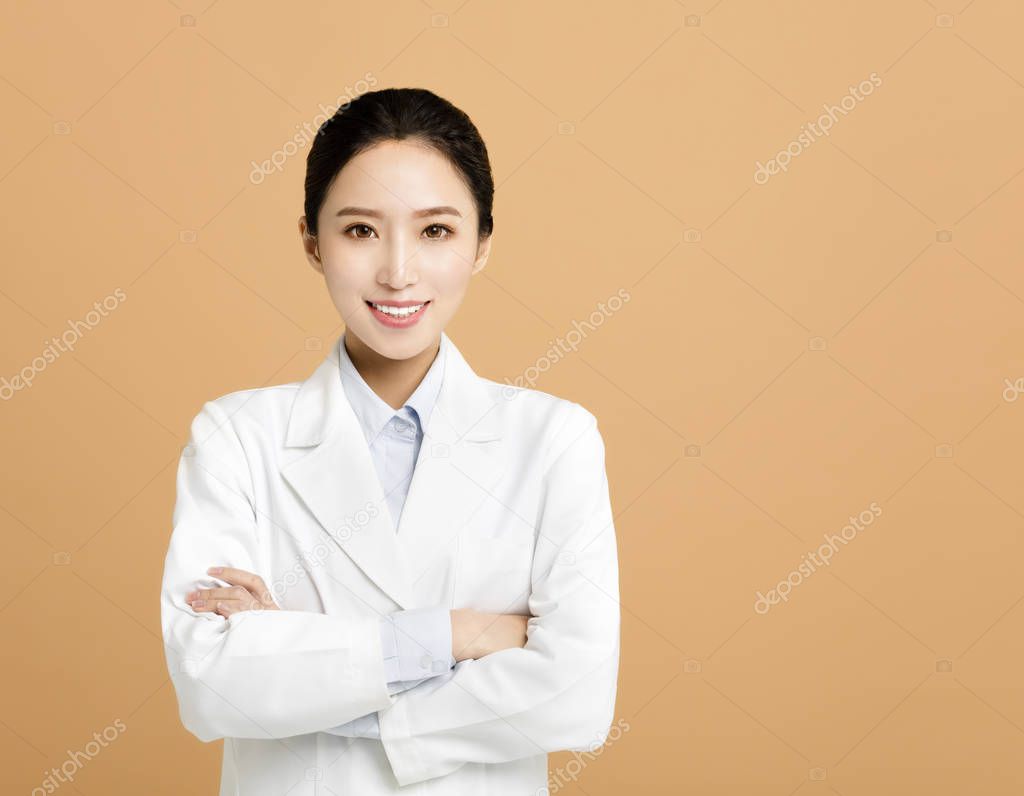 Smiling asian woman pharmacist doctor isolate