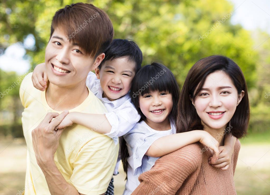 Portrait Of Happy asian Family In the park