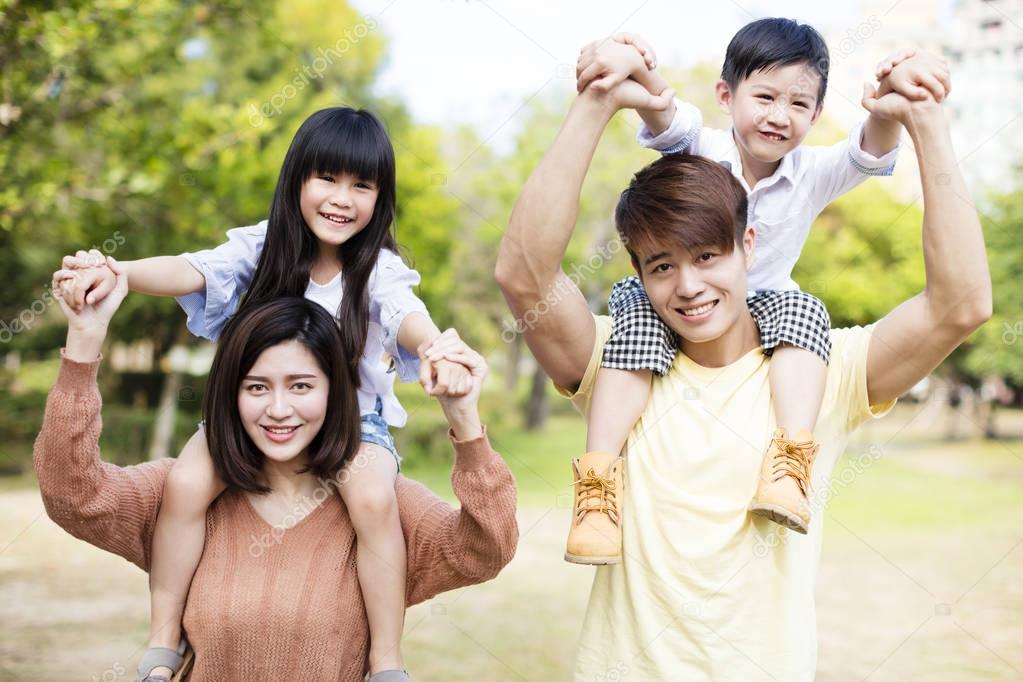 Portrait Of Happy asian Family In the park