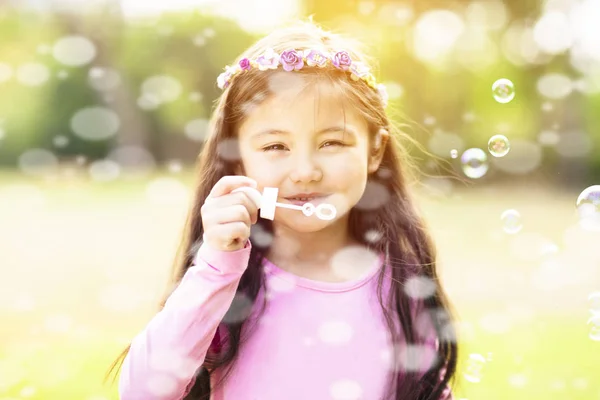 Happy Little Girl Blowing Soap Bubble — Stock Photo, Image