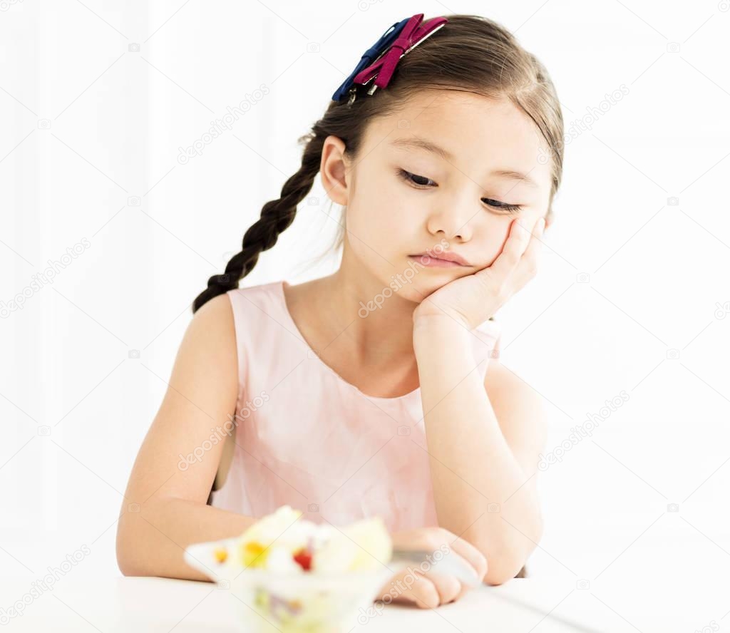sad little girl with salad