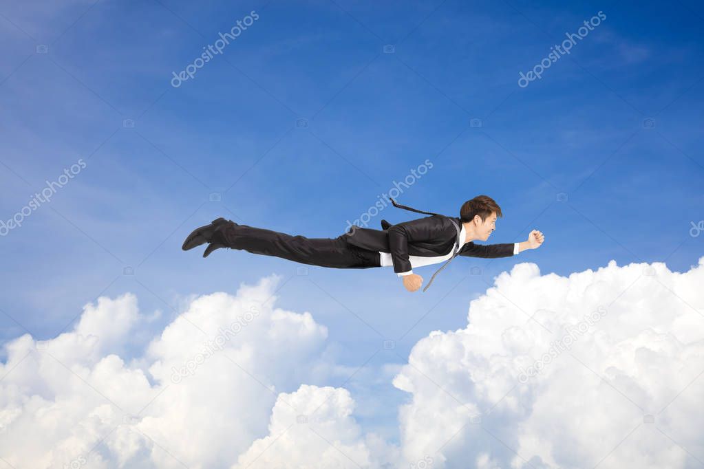 business man flying above the cloud