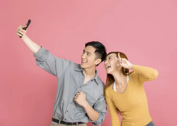 Happy young couple making selfie with smart phone — Stock Photo, Image