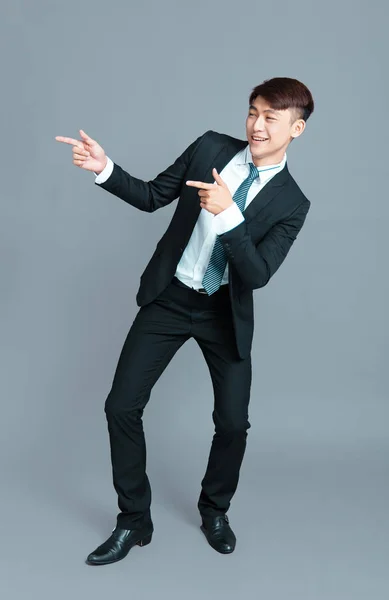 Happy young business man dancing in motion — Stock Photo, Image