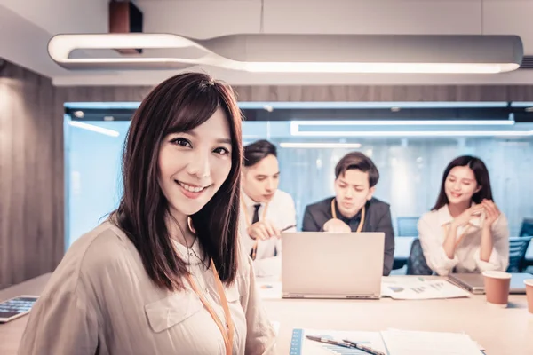 Young business woman working with her staff in office — Stock Photo, Image