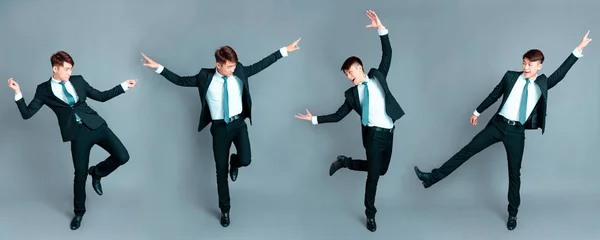 Šťastný mladý podnikatel tančí v pohybu — Stock fotografie