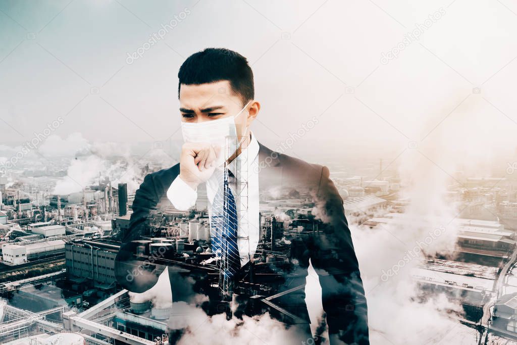 business man wearing mask against smog  and  air pollution facto