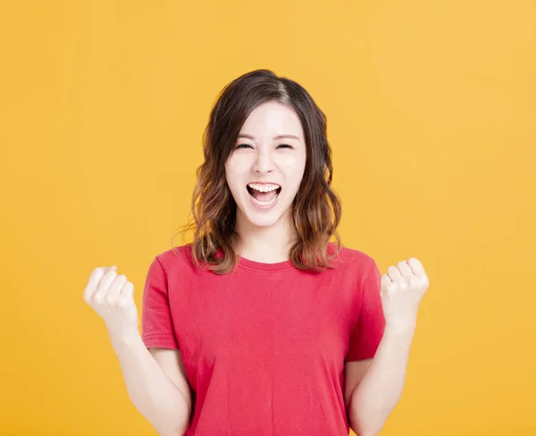 Mujer joven emocionada con gesto de éxito —  Fotos de Stock