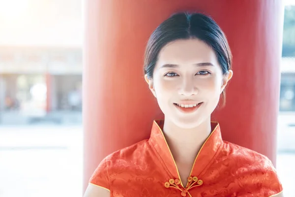 Asian young woman in old traditional Chinese dresses in the Temp