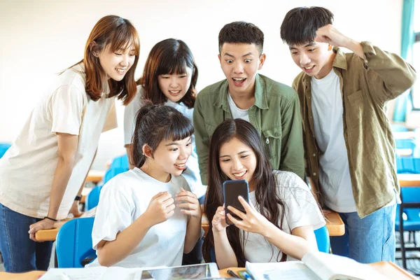 Happy Students Looking Smartphones Classroom — 스톡 사진