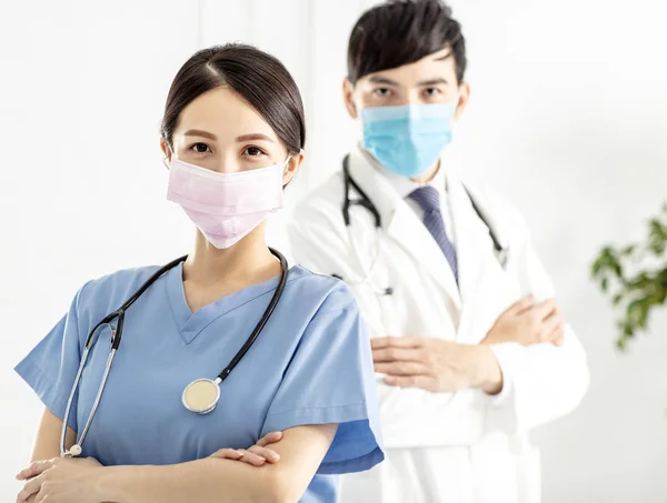 Two Doctors Faces Wearing Protective Mask — Stock Photo, Image