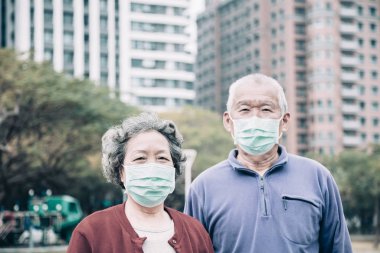 senior couple  wear with protective face mask