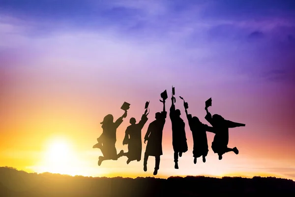 Silhouette Graduation Group Celebrating Jumping Mountain — Stock Photo, Image