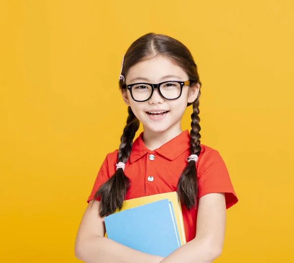 可爱的女学生拿着书本 — 图库照片