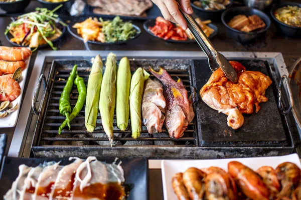 BBQ chicken and seefood  on grill at restaurant