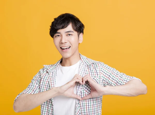 Smiling Young Man Hand Showing Heart Shape — Stock Photo, Image