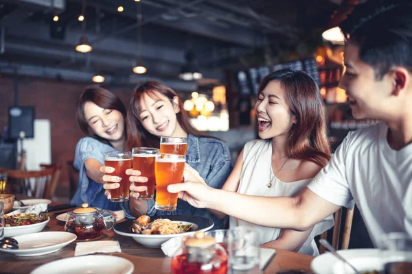 Happy Young Group Dining Drinking Beer Restaurant — Stock Photo, Image