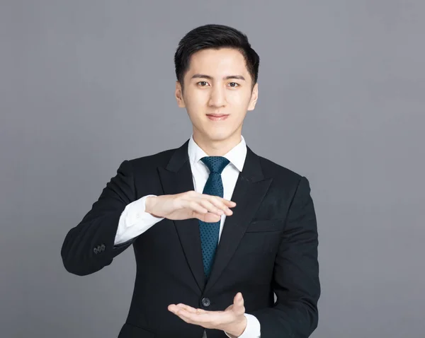 Young Business Man Holding Showing Gesture — Stock Photo, Image