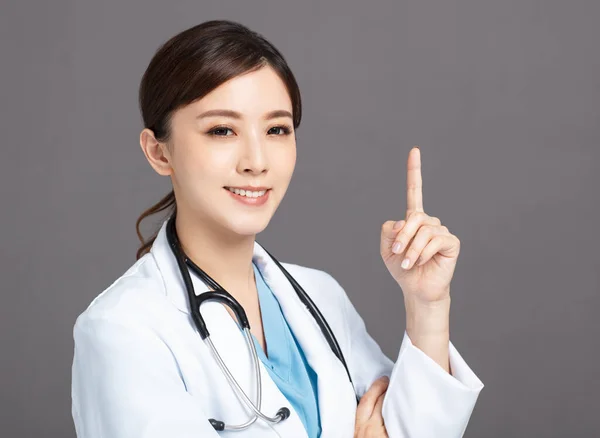 Smiling Asian Female Doctor Hand Point — Stock Photo, Image