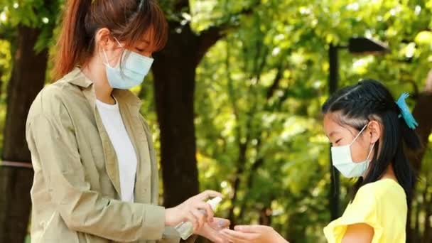 Mother Daughter Using Wash Hand Sanitizer Gel — Stock Video