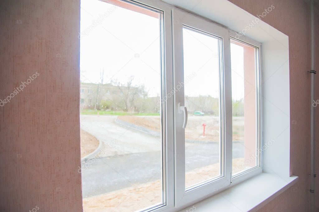 Modern residential window with blue sky behind