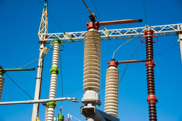 High voltage power transformer substation on blue sky background