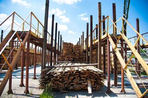 Warehouse of building materials, wood planks stacked