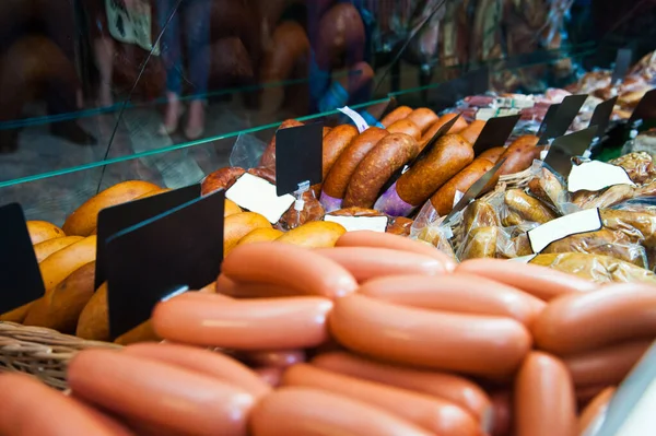 Sausages in a butcher shop window — Stock Photo, Image