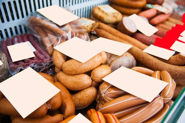 Sausages in a butcher shop window — Stock Photo, Image