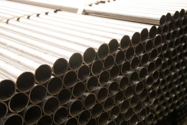 Plant for the production of metal pipes. Stack of steel pipes — Stock Photo, Image