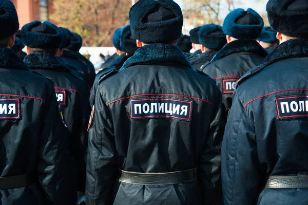 Russian police officers in uniform. Text in russian: \