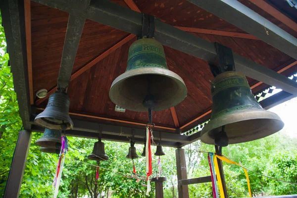 Large Church bells hanging. Church bell, several Church bells, bell ringing
