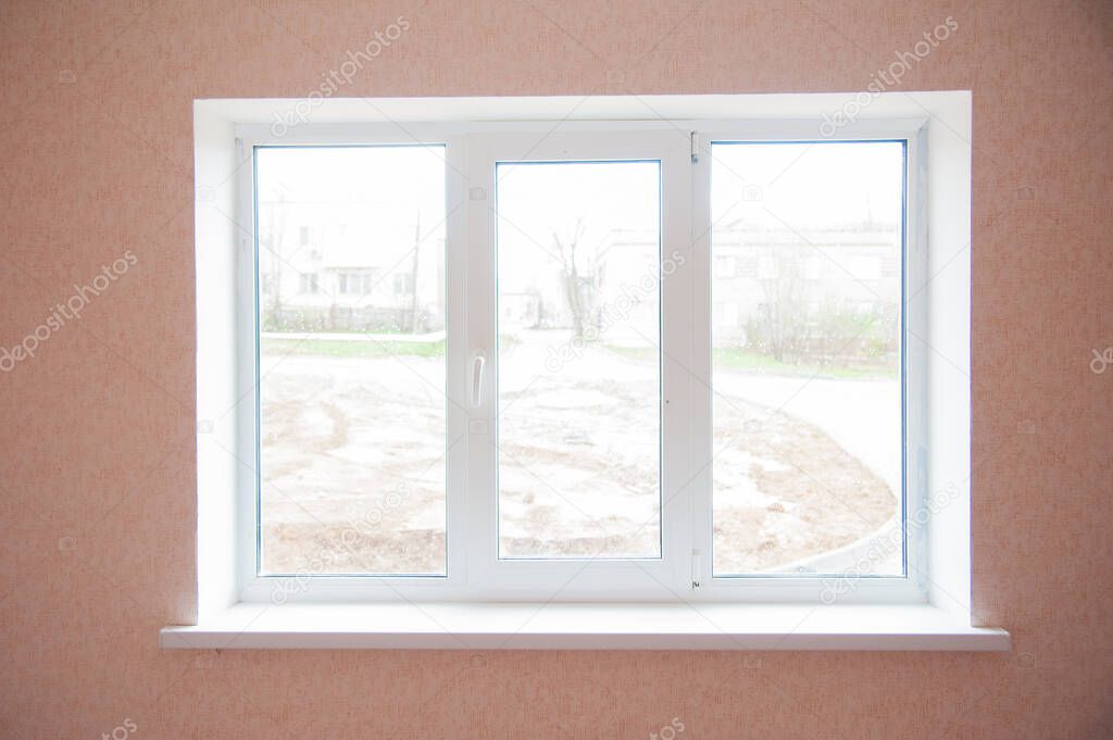 Modern residential window with blue sky behind
