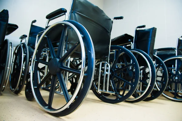 Empty standard wheel chair parked in hospital