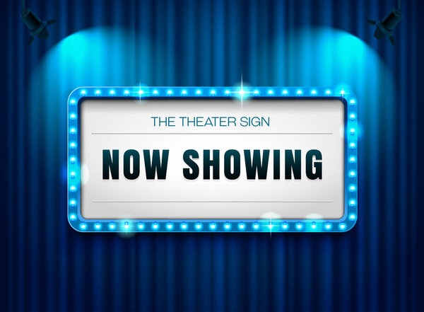 theater sign on curtain with spotlight