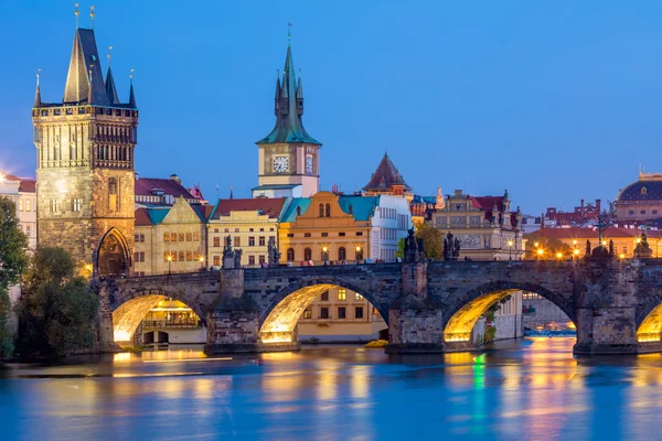 Famous Prague Landmarks - towers and bridge at night — Stock Photo, Image