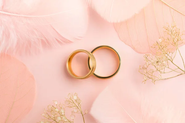 Elegant Love background - two golden rings and decorations — Stock Photo, Image