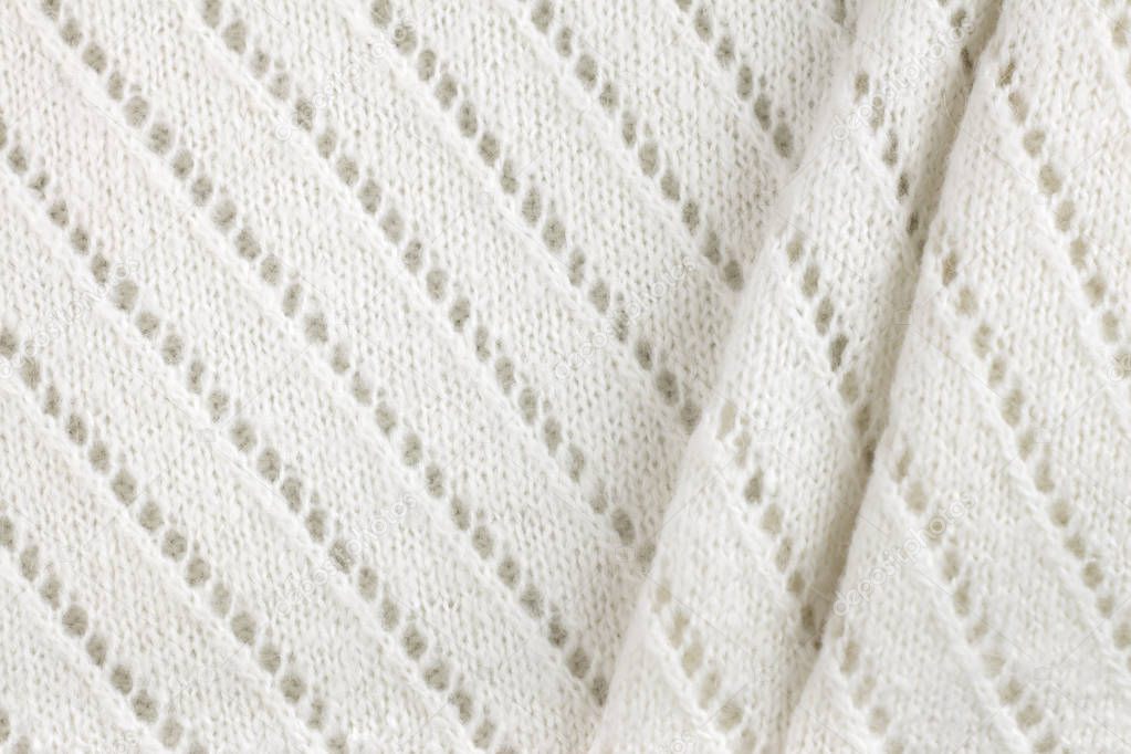 White woolen knitted fabric texture background