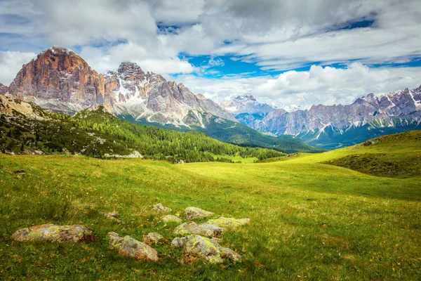 Mountain green valley panoramic landscape with big peaks, summer day in Dolomites Alps, Europe