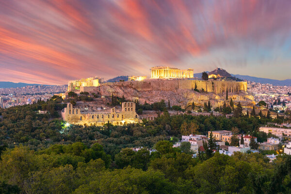 The Acropolis of Athens, Greece, with the Parthenon Temple with lights during sunset. Athens, Greece, Europe