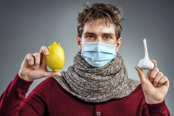 Ill man wears protective mask against infectious diseases and flu.