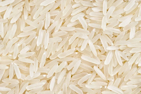 Background of parboiled rice. Lose up, top view