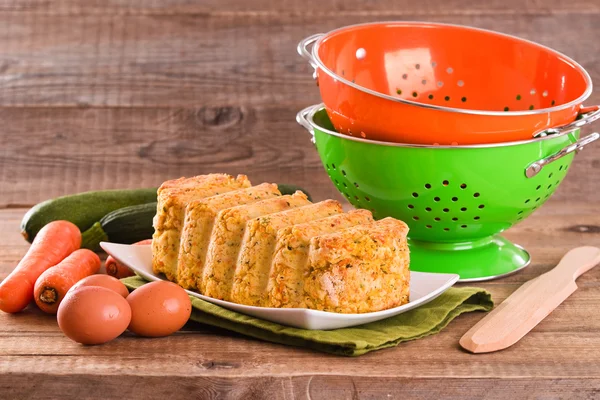 Vegetable meatloaf on white dish. — Stock Photo, Image