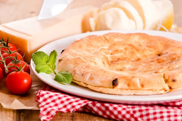 Cheese focaccia bread on white dish. — Stock Photo, Image