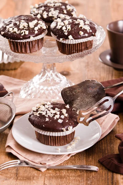 Chocolate muffin on white dish. — Stock Photo, Image