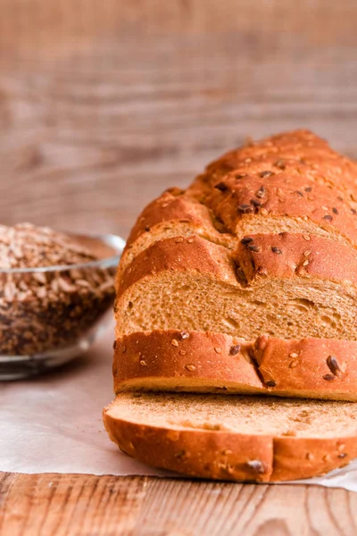 Whole wheat bread on baking paper. — Stock Photo, Image