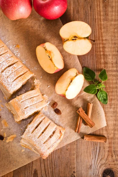 Apple strudel on baking paper. — Stock Photo, Image