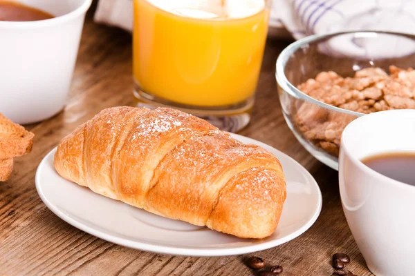 Breakfast with croissant on white dish. — Stock Photo, Image